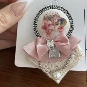 Elegant Pink Brooch with Bow and Pearl